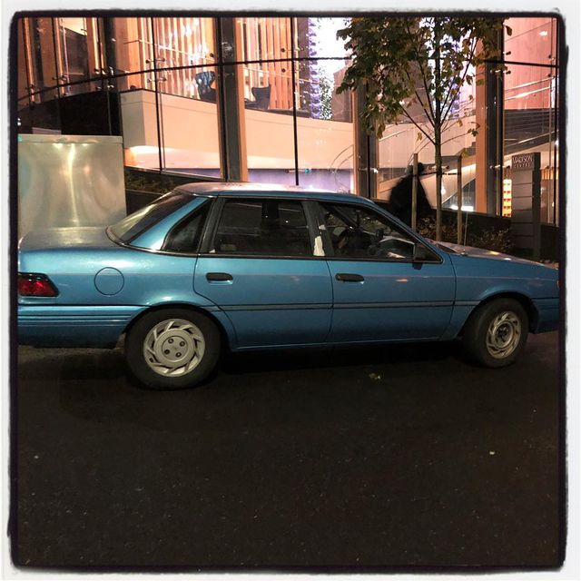 Imagine the dedication and love required to keep a 1990 Ford Tempo GL sedan running and looking this good on the streets of Seattle The neon pink pin stripe is amazing